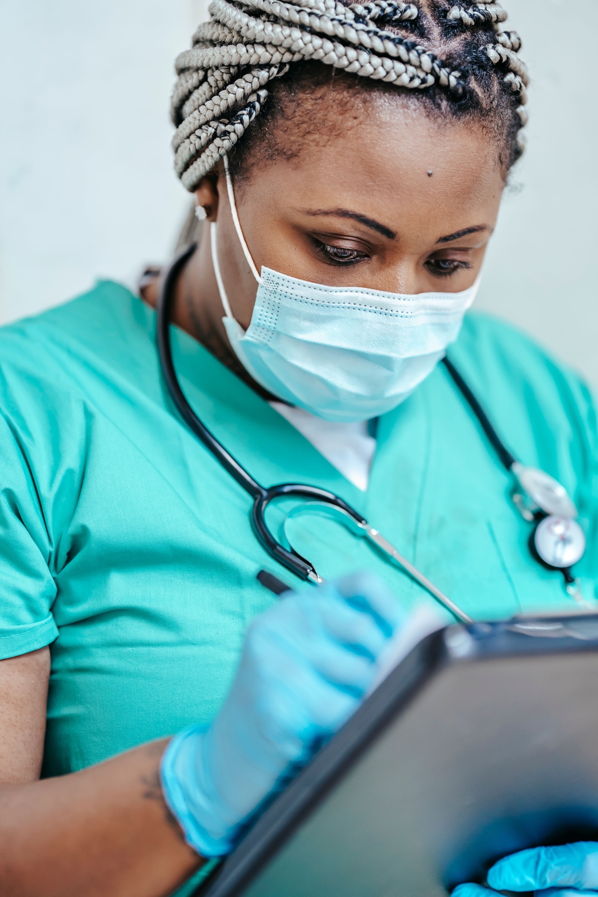 Healthcare professional preparing a patient assessment